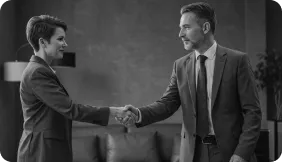 Two men in suit shaking hands